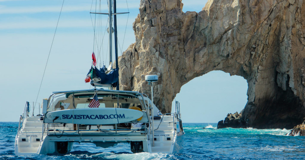 Sea Esta Cabo luxury catamaran sailing near the famous Cabo rock formations